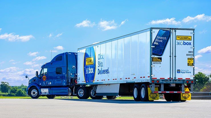 Original J.B. Hunt 360box launch imagery with Click. Ship. Delivered. trailer branding